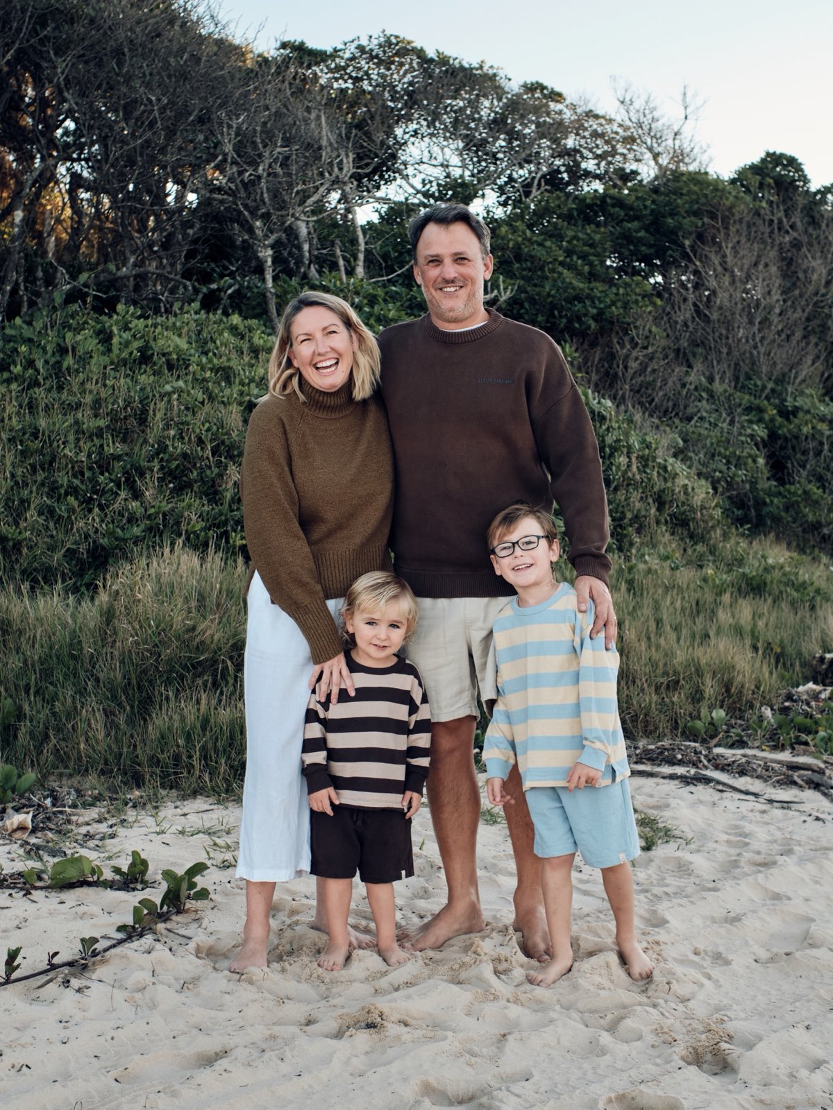 Caleb from CWS with Shelley and their two boys, Leon and Darwin, on the beach at Nambucca Heads
